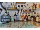 Home bar with extensive liquor selection and a marble countertop at 830 Maralyn Ave, New Smyrna Beach, FL 32169