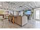 Open concept living area with vaulted ceiling and exposed beams at 830 Maralyn Ave, New Smyrna Beach, FL 32169