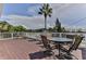 Relaxing deck with table, chairs, and loungers, offering scenic views at 830 Maralyn Ave, New Smyrna Beach, FL 32169