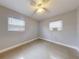 Well-lit bedroom with ceiling fan and window at 104 Fran Dr, New Smyrna Beach, FL 32168