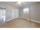 Spacious bedroom with neutral walls and sliding door closet at 104 Fran Dr, New Smyrna Beach, FL 32168