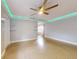 Spacious living room with light grey walls, concrete floors, and ceiling fan at 104 Fran Dr, New Smyrna Beach, FL 32168