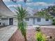 Updated home with modern gray exterior and landscaping at 104 Fran Dr, New Smyrna Beach, FL 32168