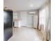 Modern kitchen with white cabinets and stainless steel appliances at 104 Fran Dr, New Smyrna Beach, FL 32168