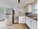 Renovated kitchen, white cabinets, granite countertop at 104 Fran Dr, New Smyrna Beach, FL 32168