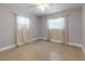 Bright bedroom with neutral walls and speckled floor at 104 Fran Dr, New Smyrna Beach, FL 32168