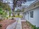 Updated home with charming front yard landscaping at 104 Fran Dr, New Smyrna Beach, FL 32168