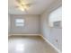 Simple bedroom with ceiling fan and window at 104 Fran Dr, New Smyrna Beach, FL 32168