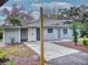 Mid-century modern home with updated exterior and landscaping at 104 Fran Dr, New Smyrna Beach, FL 32168