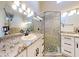 Bathroom with granite countertops, a walk-in shower, and modern fixtures at 804 Soft Pine Ct, New Smyrna Beach, FL 32168