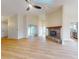 Bright living room featuring a fireplace and hardwood floors at 804 Soft Pine Ct, New Smyrna Beach, FL 32168
