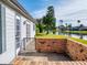 Private patio with brick wall and canal view at 804 Soft Pine Ct, New Smyrna Beach, FL 32168