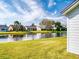 Waterfront backyard with lush lawn and lake view at 804 Soft Pine Ct, New Smyrna Beach, FL 32168