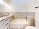 Bathroom with a bathtub and tile surround at 804 Soft Pine Ct, New Smyrna Beach, FL 32168
