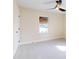Bright bedroom with neutral walls, ceiling fan, and plush carpeting at 804 Soft Pine Ct, New Smyrna Beach, FL 32168