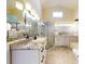 Elegant bathroom with granite countertops, a large shower, and a soaking tub at 804 Soft Pine Ct, New Smyrna Beach, FL 32168