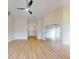 Long hallway with light walls and hardwood flooring at 804 Soft Pine Ct, New Smyrna Beach, FL 32168