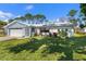 Front yard view of a single-Gathering home with landscaping at 1213 Jeffery Dr, Port Orange, FL 32129