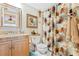 Bathroom featuring granite countertop, updated toilet and shower at 4501 S Atlantic Ave # 1210, New Smyrna Beach, FL 32169
