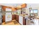 Modern kitchen with wood cabinets and granite countertops at 4501 S Atlantic Ave # 1210, New Smyrna Beach, FL 32169