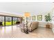 Living room with sliding doors to a grassy patio area at 4501 S Atlantic Ave # 1210, New Smyrna Beach, FL 32169