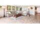 Tan leather sectional sofa and wood coffee table in living room at 4501 S Atlantic Ave # 1210, New Smyrna Beach, FL 32169