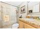 Bathroom with granite vanity and a large walk-in shower at 4501 S Atlantic Ave # 1210, New Smyrna Beach, FL 32169