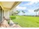 Private patio with ocean view and lush landscaping at 4501 S Atlantic Ave # 1210, New Smyrna Beach, FL 32169