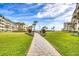 A paved pathway leads to the beach and ocean views at 4501 S Atlantic Ave # 1210, New Smyrna Beach, FL 32169