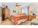 Spacious bedroom with a king-size bed and wooden furniture at 4501 S Atlantic Ave # 1210, New Smyrna Beach, FL 32169