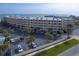 Aerial view of beachfront building and parking area at 4501 S Atlantic Ave # 1210, New Smyrna Beach, FL 32169