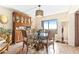 Charming dining area with glass-top table and ocean view at 4501 S Atlantic Ave # 1210, New Smyrna Beach, FL 32169