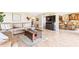 Spacious living area with leather furniture and hardwood floors at 4501 S Atlantic Ave # 1210, New Smyrna Beach, FL 32169