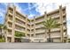 Condo building with palm trees and ocean view at 4501 S Atlantic Ave # 1210, New Smyrna Beach, FL 32169
