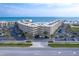 Oceanfront condo building with ample parking and tropical landscaping at 4501 S Atlantic Ave # 1210, New Smyrna Beach, FL 32169