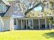 House with a screened porch and large backyard at 226 Wildwood Ave, Edgewater, FL 32132