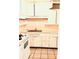 Basic kitchen with white cabinets and tile floor at 226 Wildwood Ave, Edgewater, FL 32132