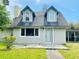 Charming house with a gabled roof and dormer windows at 226 Wildwood Ave, Edgewater, FL 32132