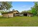 Property features two large outbuildings, offering ample storage space at 1795 Hideaway Ln, Edgewater, FL 32141