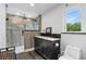 Modern bathroom with double vanity, walk-in shower, and stylish finishes at 1795 Hideaway Ln, Edgewater, FL 32141