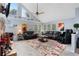 Open living area with a stone fireplace, large windows, and comfortable seating at 1795 Hideaway Ln, Edgewater, FL 32141