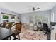 Bright breakfast nook with table and chairs, providing a view of the backyard at 1795 Hideaway Ln, Edgewater, FL 32141