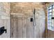 Large walk-in shower with stylish tile and glass block window at 1795 Hideaway Ln, Edgewater, FL 32141