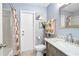 Guest bathroom with single vanity, shower/tub combo, and updated fixtures at 1795 Hideaway Ln, Edgewater, FL 32141