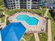 Relaxing community pool with ample lounge chairs at 2700 N Peninsula Ave # 536, New Smyrna Beach, FL 32169