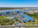 Aerial view of waterfront condo community with tennis courts and parking at 2700 N Peninsula Ave # 536, New Smyrna Beach, FL 32169