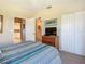 Main bedroom with a dresser, TV, and spacious closet at 2700 N Peninsula Ave # 536, New Smyrna Beach, FL 32169