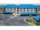 Condo building with blue roof and covered parking at 2700 N Peninsula Ave # 536, New Smyrna Beach, FL 32169