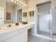 Clean bathroom with shower and white vanity at 2700 N Peninsula Ave # 536, New Smyrna Beach, FL 32169