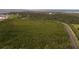 Aerial view showing home's location, landscape, and road access at 2700 N Peninsula Ave # 536, New Smyrna Beach, FL 32169